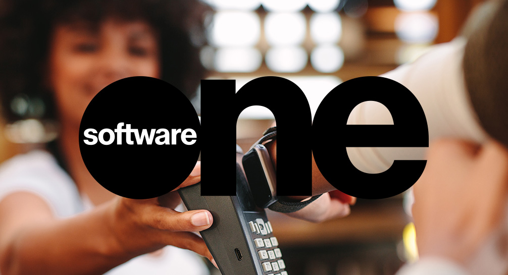 A woman is holding a phone with the word software one on it.