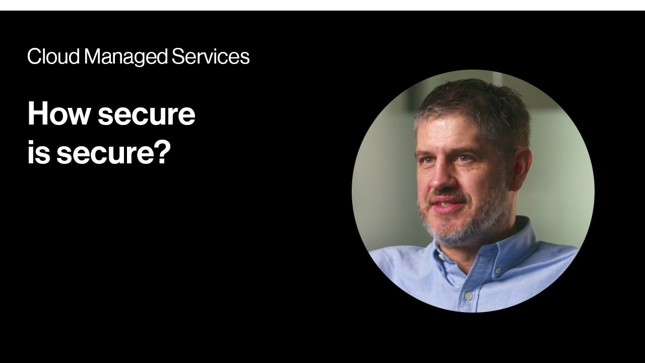 A man in a blue shirt with the words how secure is secure?.