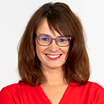 A woman wearing glasses and a red shirt.