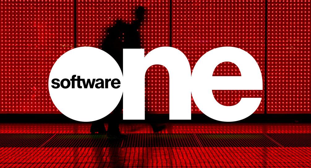 Software one logo in front of a red light.